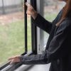 A person slides up the glass, revealing the Insect screen window – in frame.